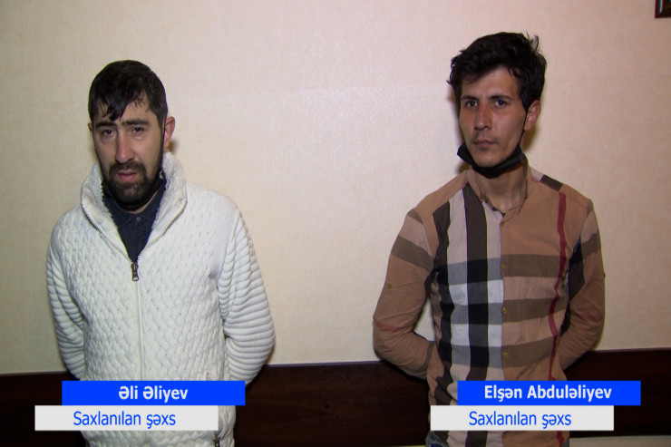 Qəbiristanlıqdan gül oğurlayan Elşən Abduləliyev və Əli Əliyev